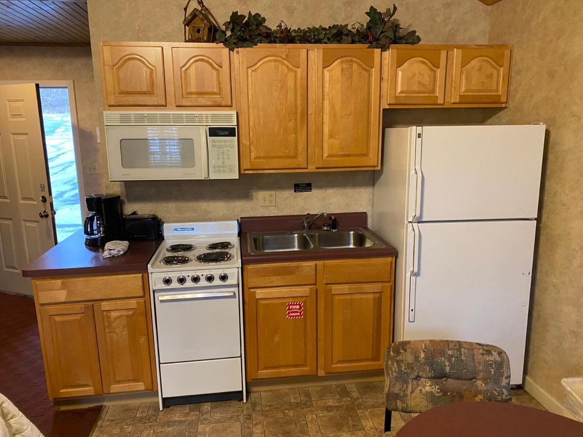 One Bedroom Cottages Kitchen Fireplace & Private Balcony on stream