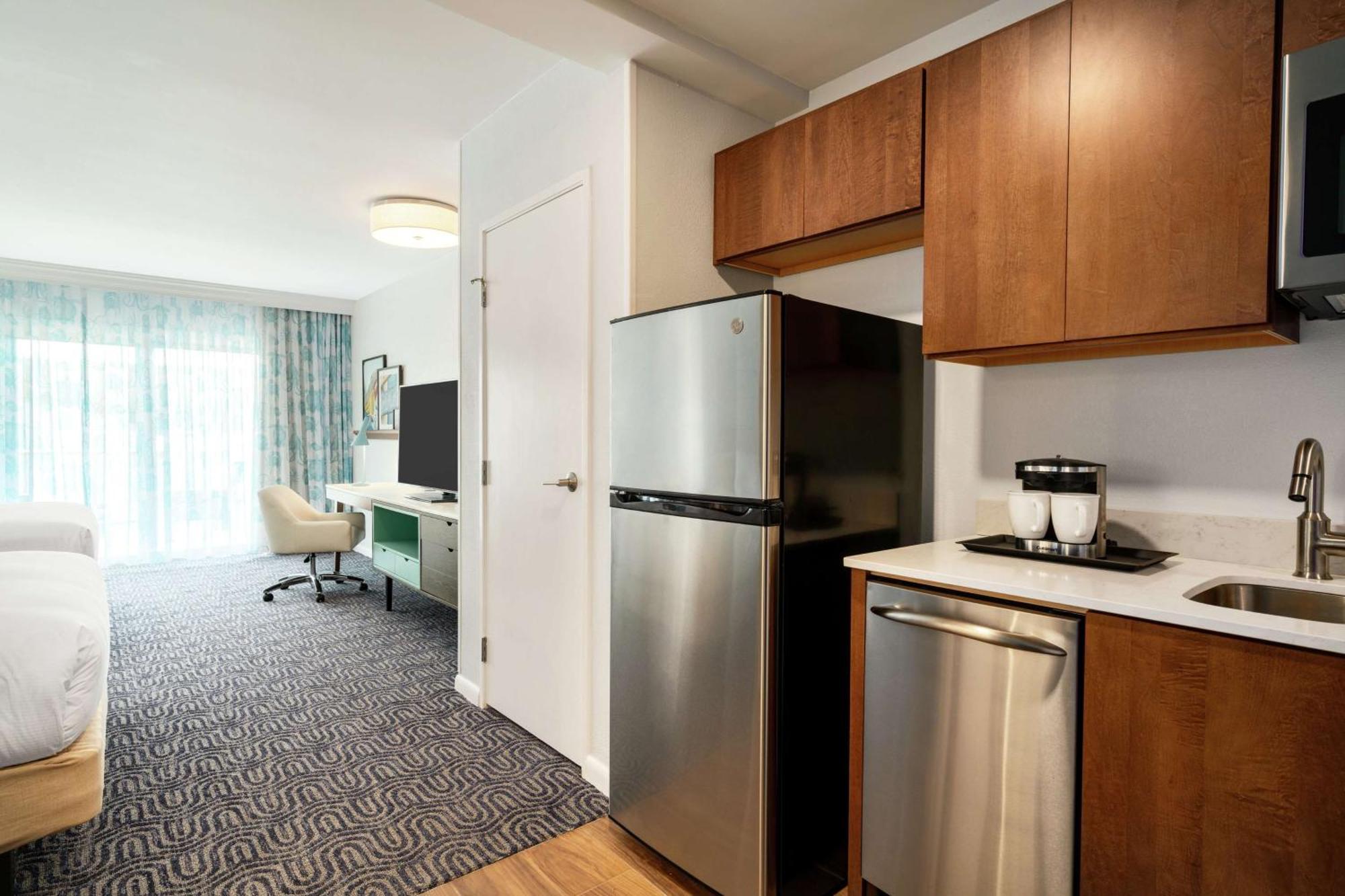 Queen Room Two Queen Beds Kitchen Partial Ocean View