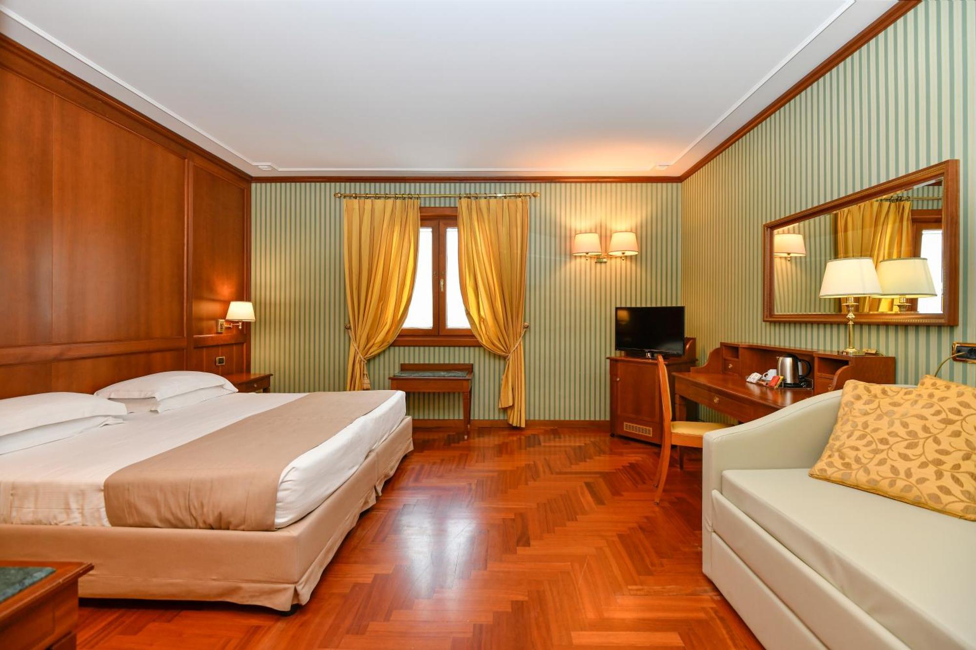 Standard Room One Queen One Single Bed