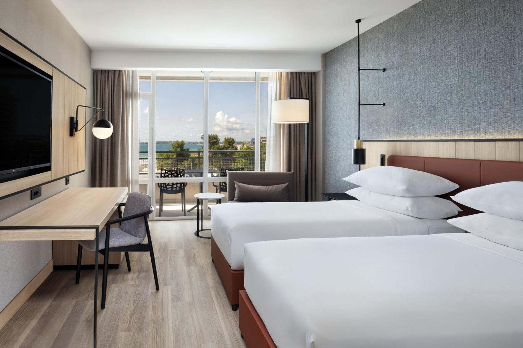 Deluxe Twin Room with Fold-out Chair and Sea View - Free Beach Access