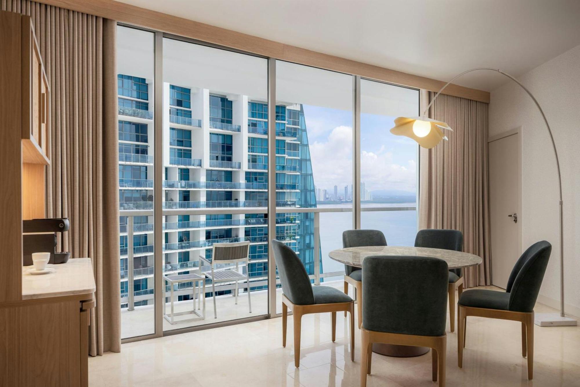 Executive suite king bed balcony partial ocean view