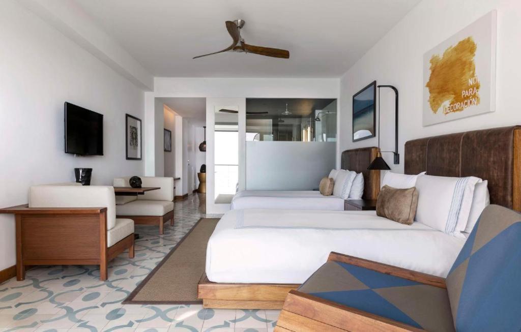 Deluxe Queen Room with Two Queen Beds and Partial Ocean View