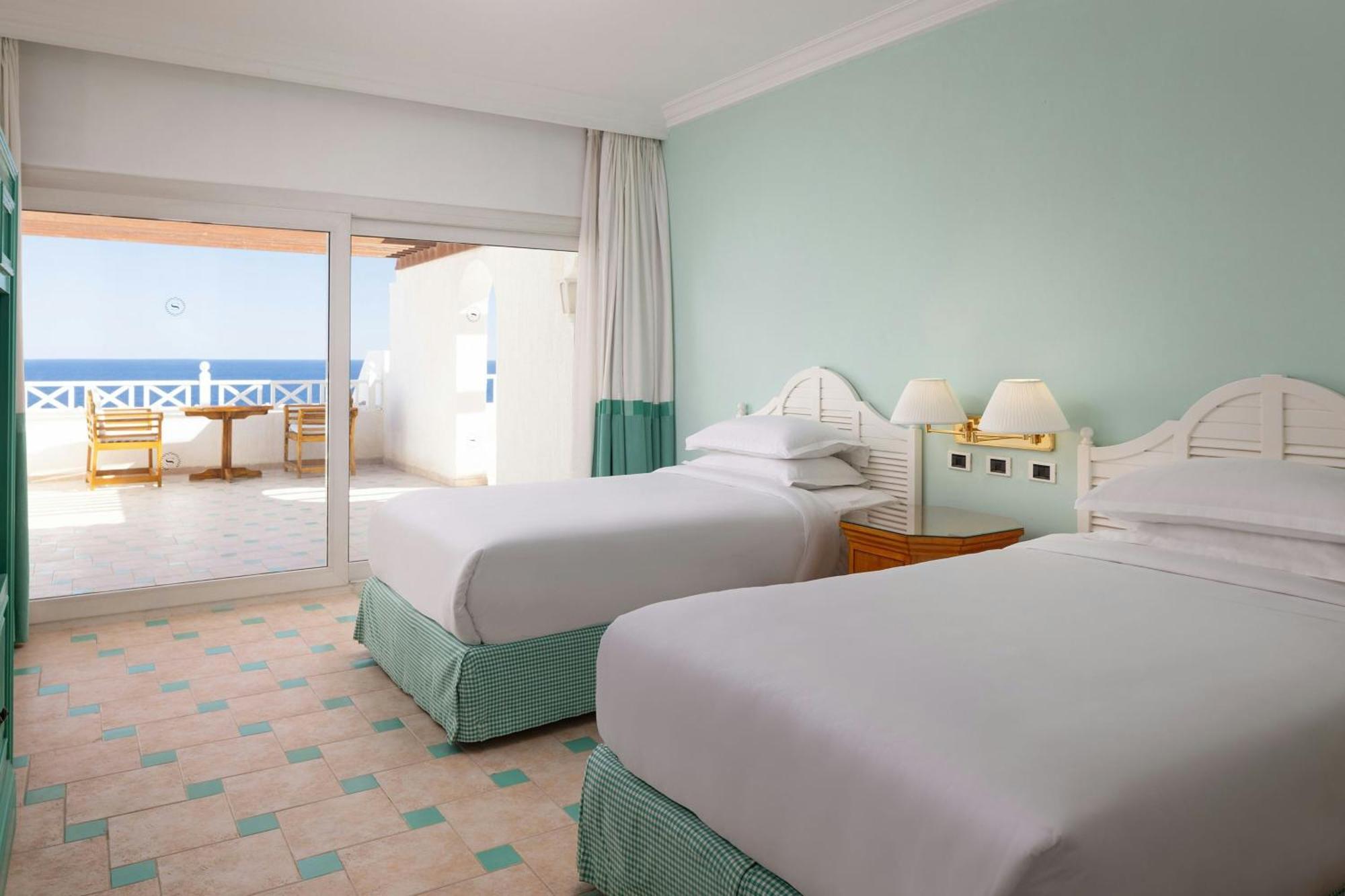 One-Bedroom Junior Suite Two Single Beds Corner Balcony Sea View High Floor
