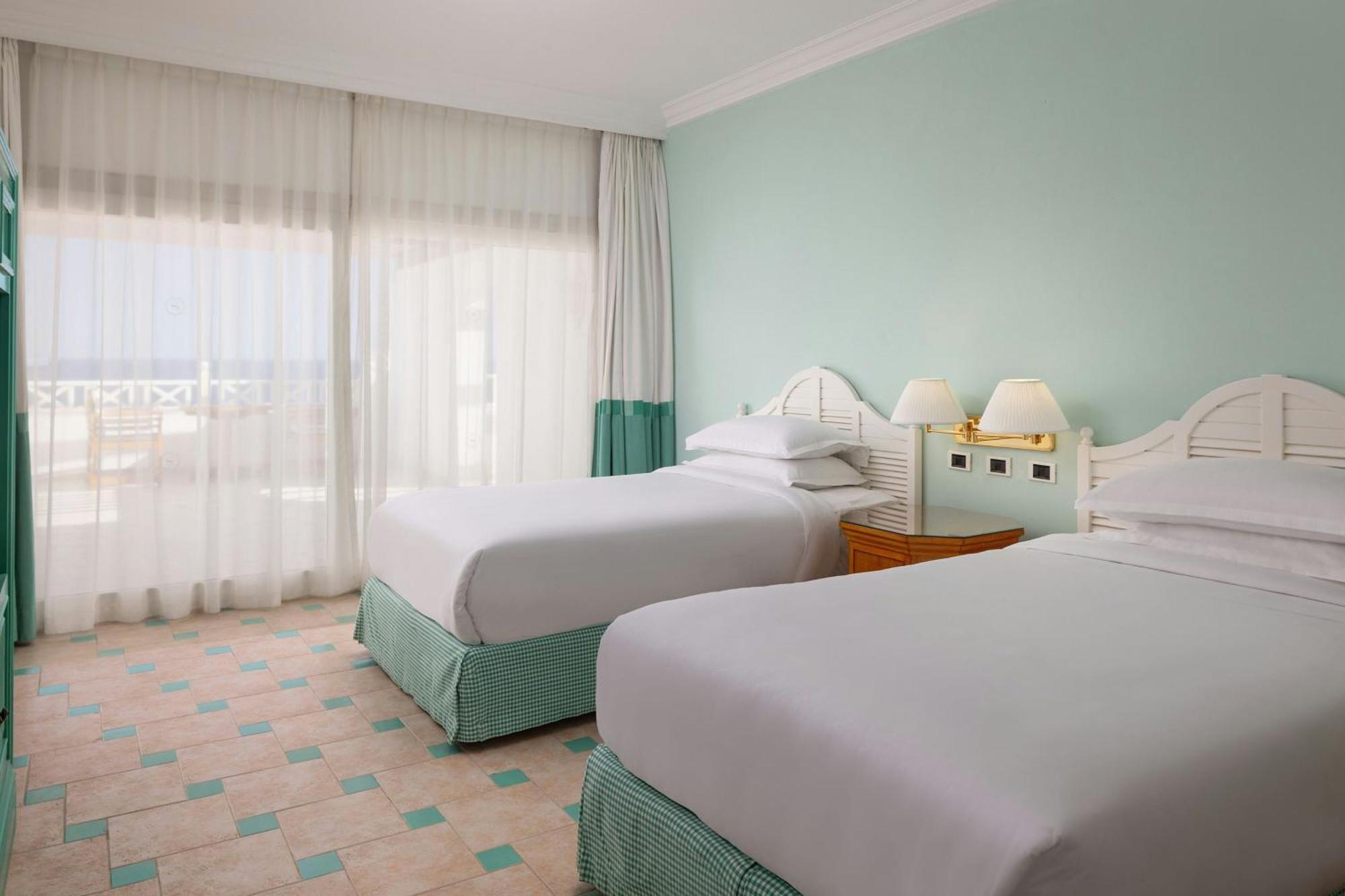 One-Bedroom Junior Suite Two Single Beds Corner Balcony Sea View High Floor