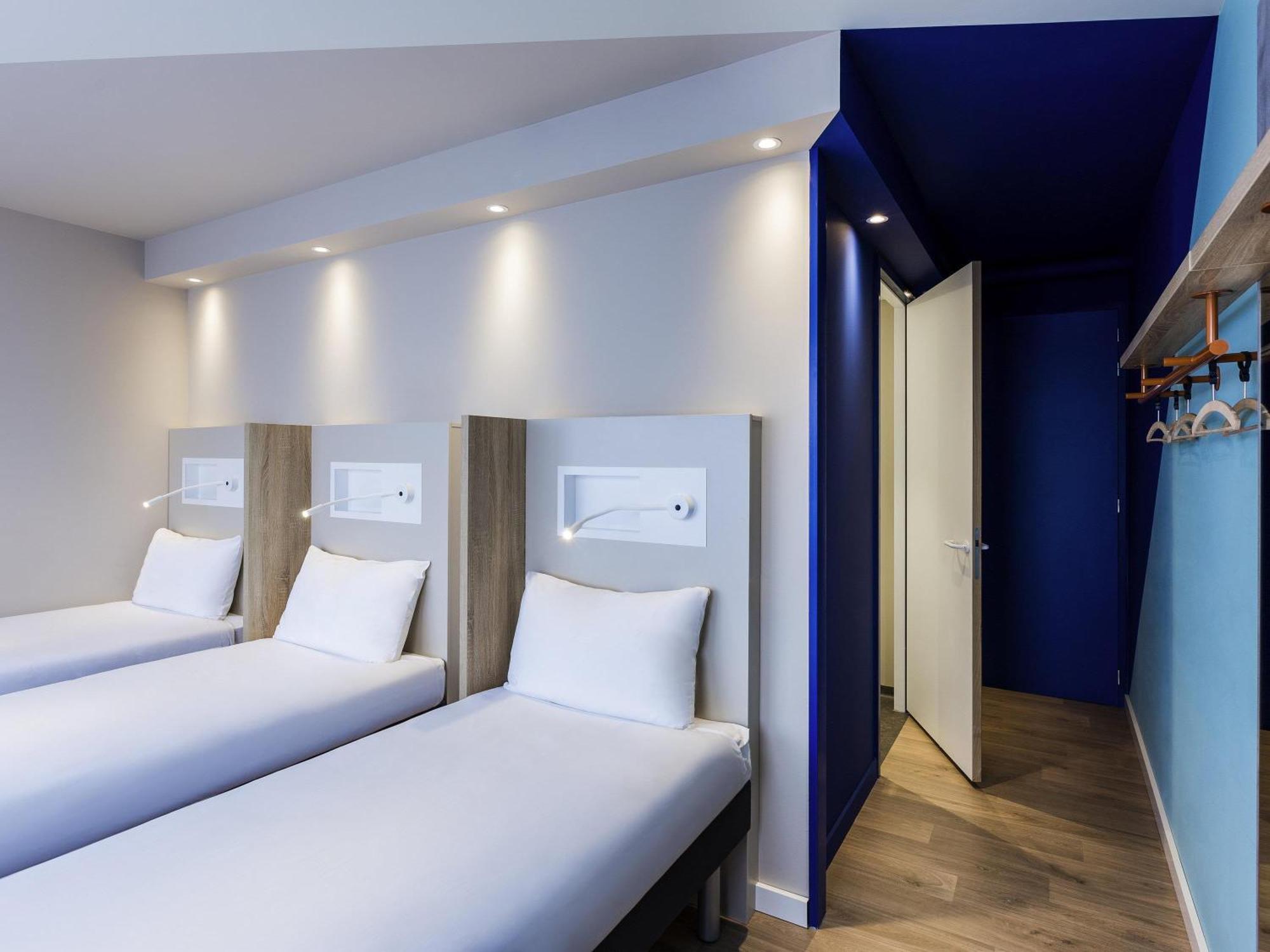 Room Three Single Beds