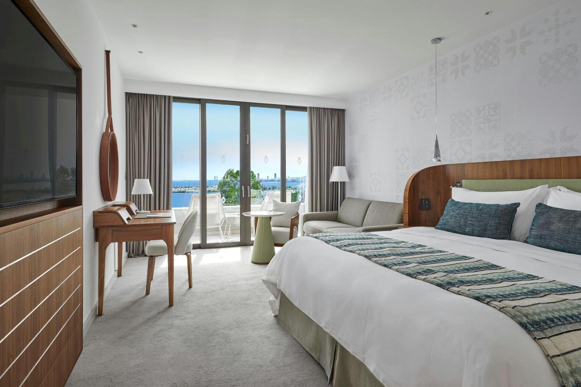 Grotere Deluxe Kamer met 1 Kingsize Bed en een Slaapbank - Uitzicht op Zee